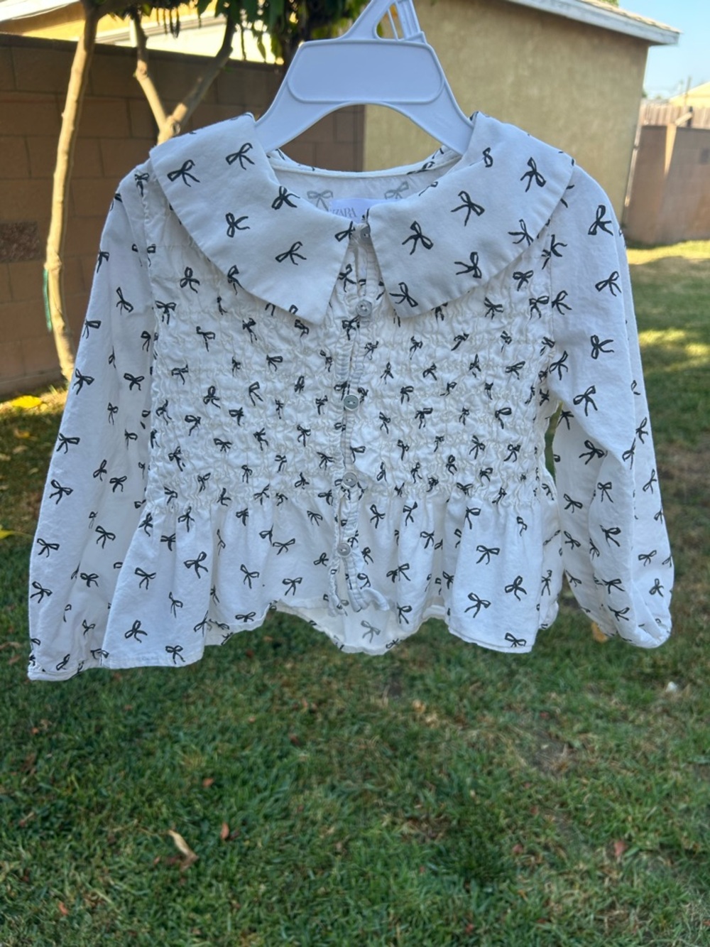 Zara White Long-Sleeve Smocked Top with Black Bow Print